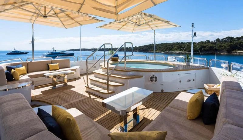 a large white boat on a deck aboard GALAXY Yacht for Sale