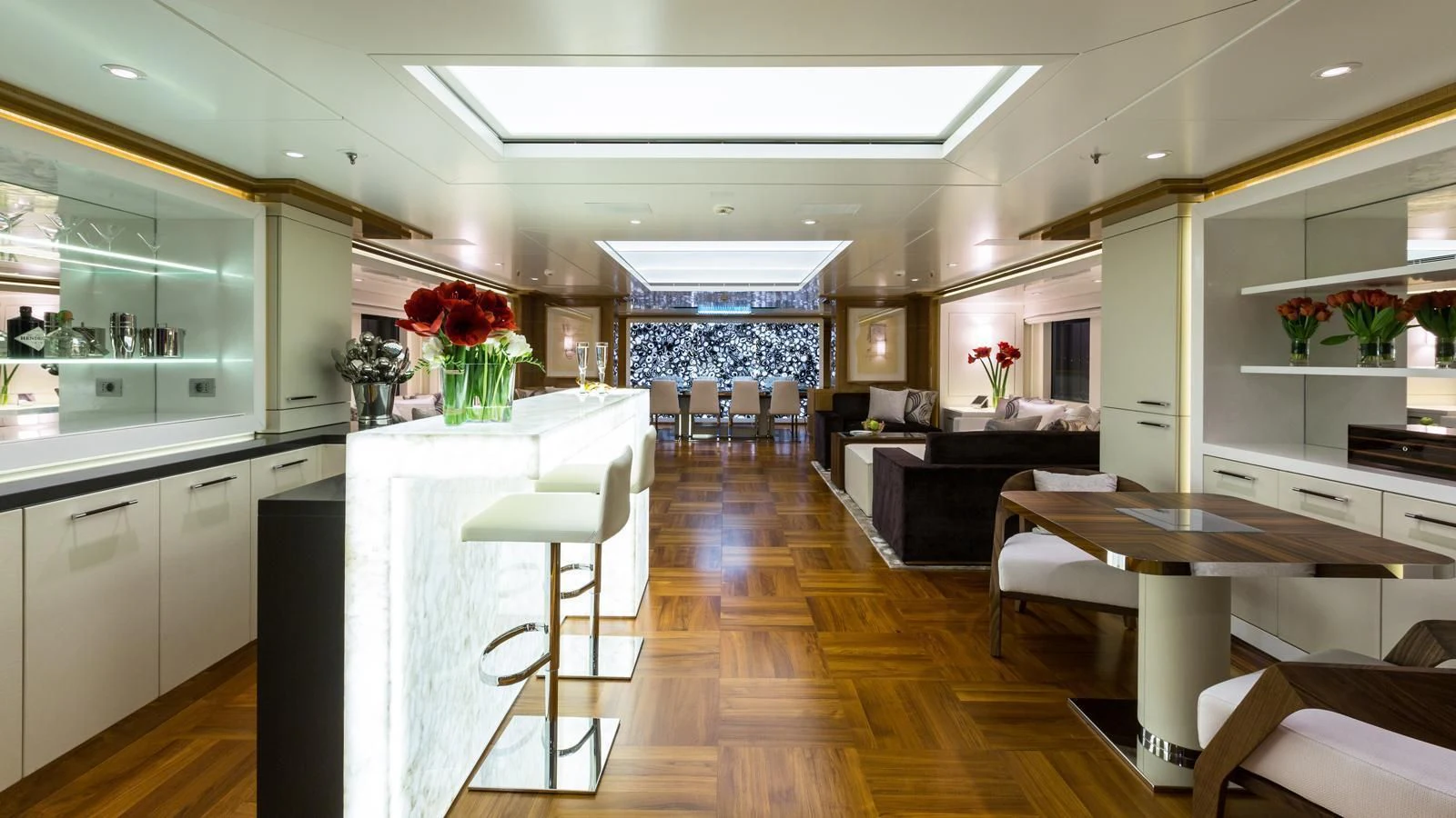 a large kitchen with a dining table aboard GALAXY Yacht for Sale