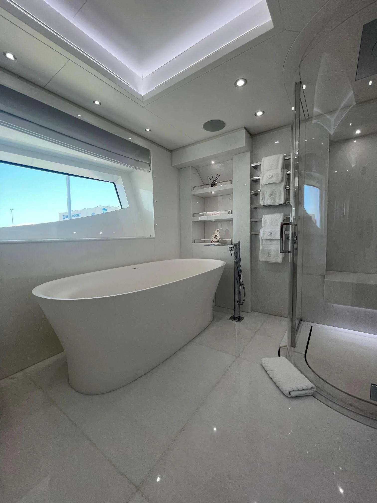 a bathroom with a tub and sink aboard GALAXY Yacht for Sale