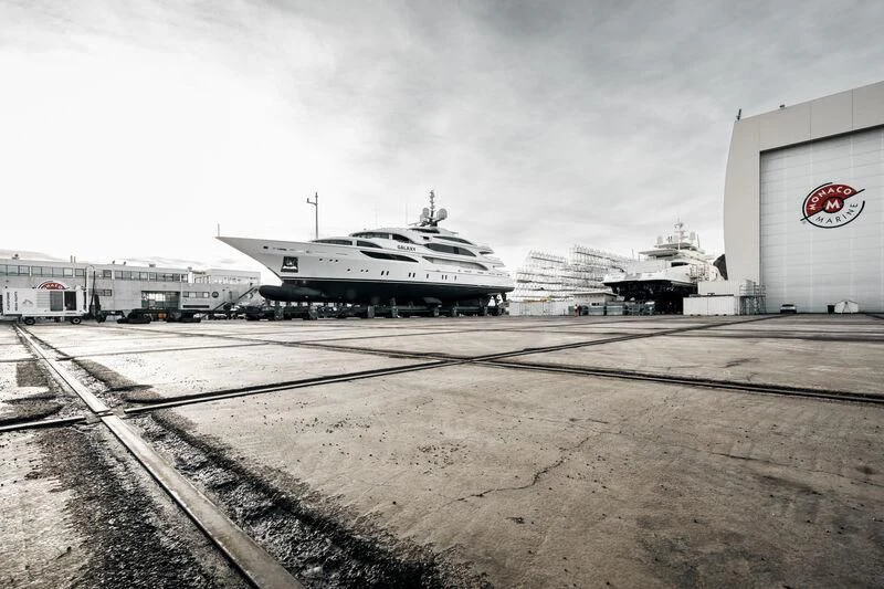 a large white ship in a parking lot aboard GALAXY Yacht for Sale