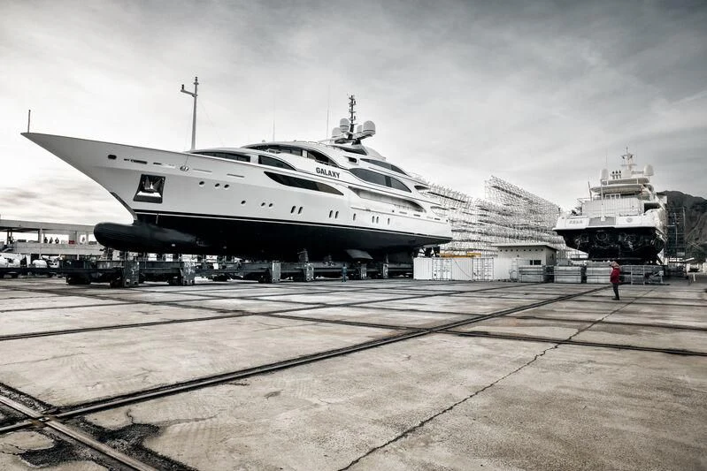 a large airplane sits on a runway aboard GALAXY Yacht for Sale