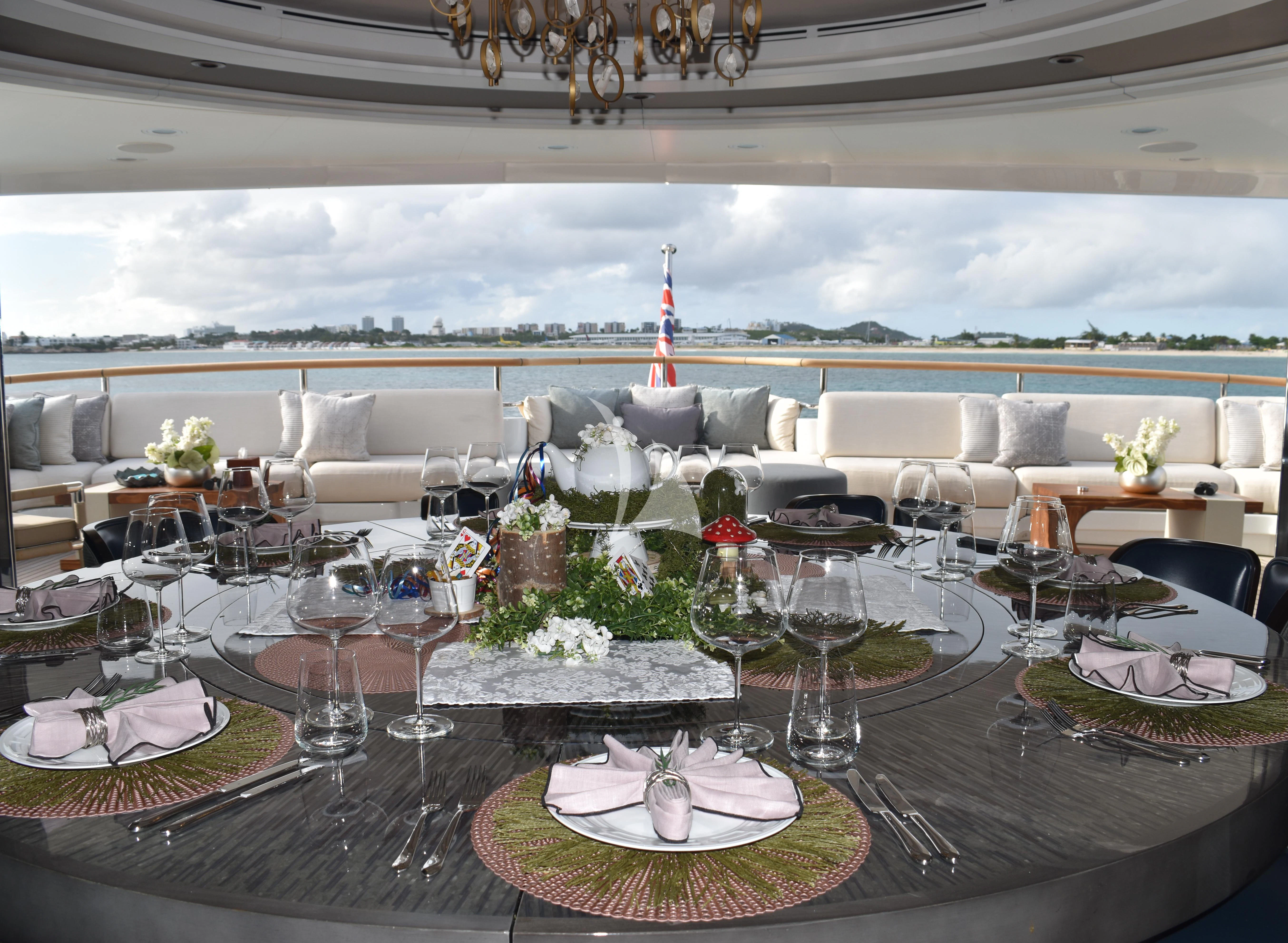 a large room with tables and chairs aboard GALAXY Yacht for Sale