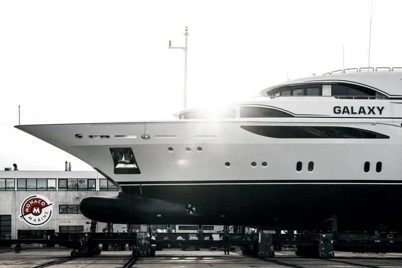 a large airplane is parked at an airport aboard GALAXY Yacht for Sale