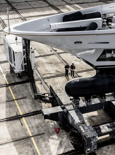 a person standing next to a plane aboard GALAXY Yacht for Sale