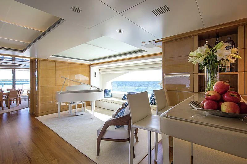 a room with a table and chairs aboard GALAXY Yacht for Sale