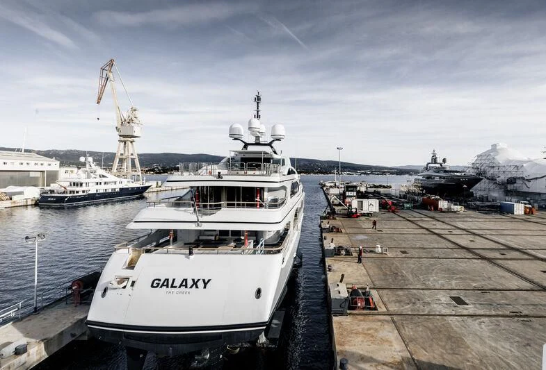 a boat docked at a pier aboard GALAXY Yacht for Sale