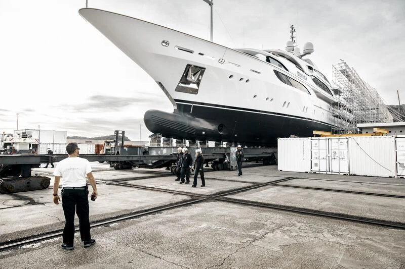 a person walking towards a plane aboard GALAXY Yacht for Sale