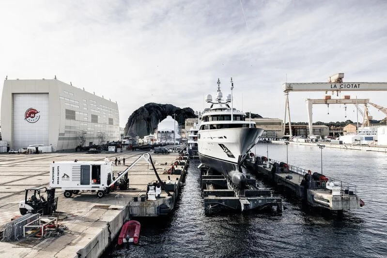 a large ship docked at a port aboard GALAXY Yacht for Sale