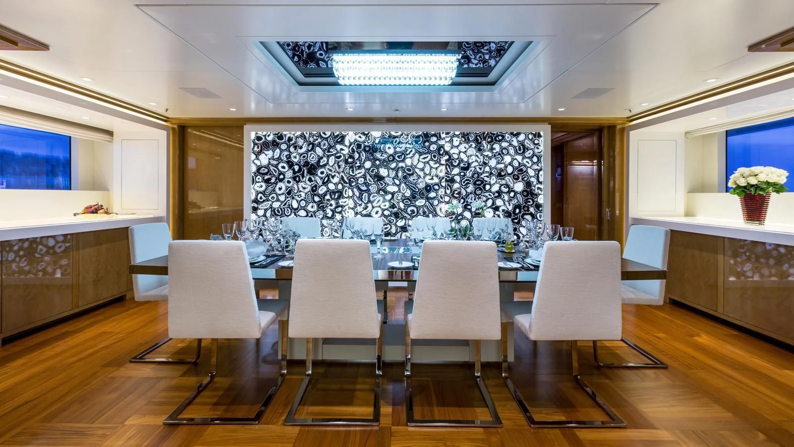 a room with a table and chairs aboard GALAXY Yacht for Sale