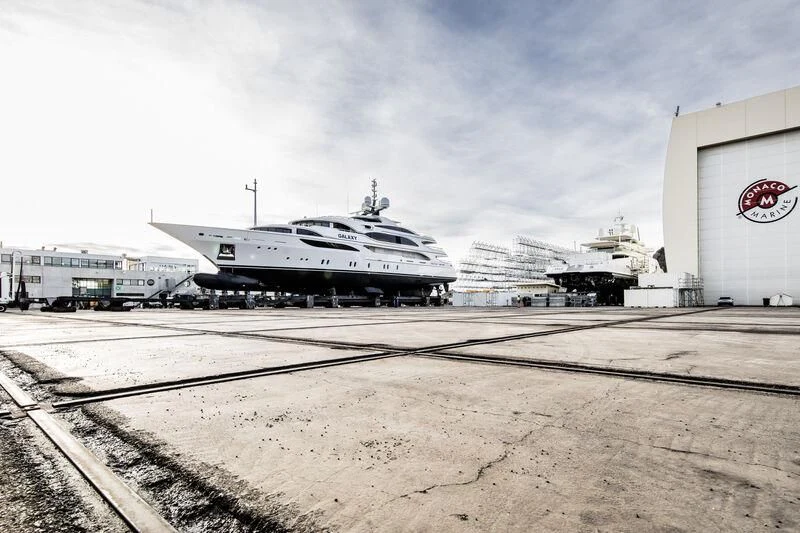 a large white airplane sits on the tarmac aboard GALAXY Yacht for Sale