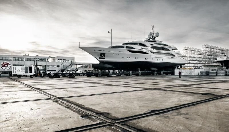 a large airplane is parked at a loading dock aboard GALAXY Yacht for Sale
