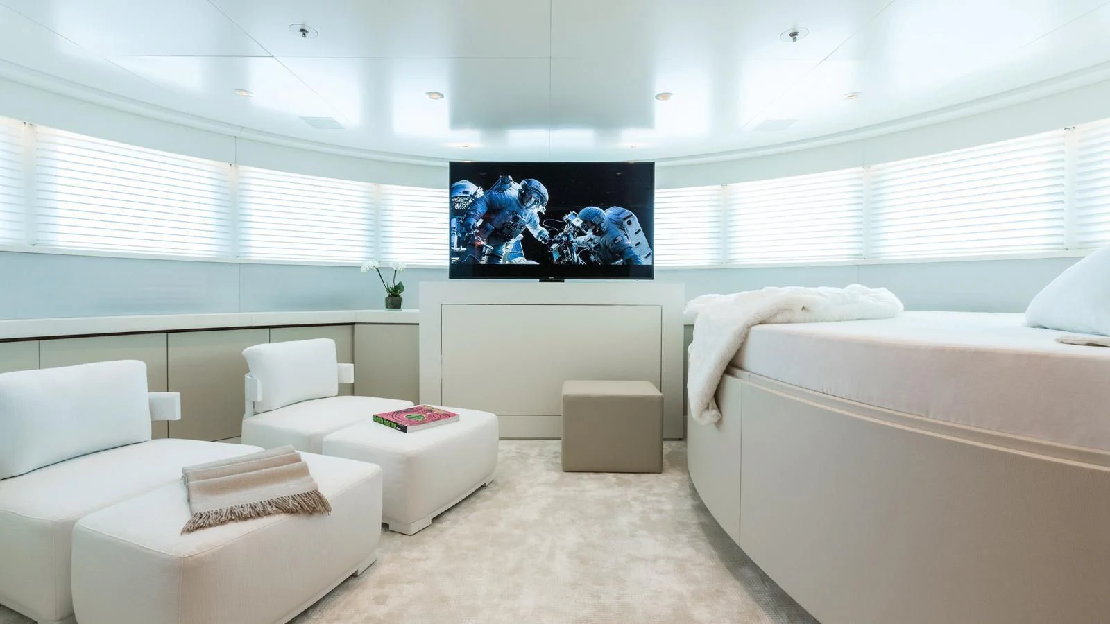 a room with a bed and a television aboard GALAXY Yacht for Sale