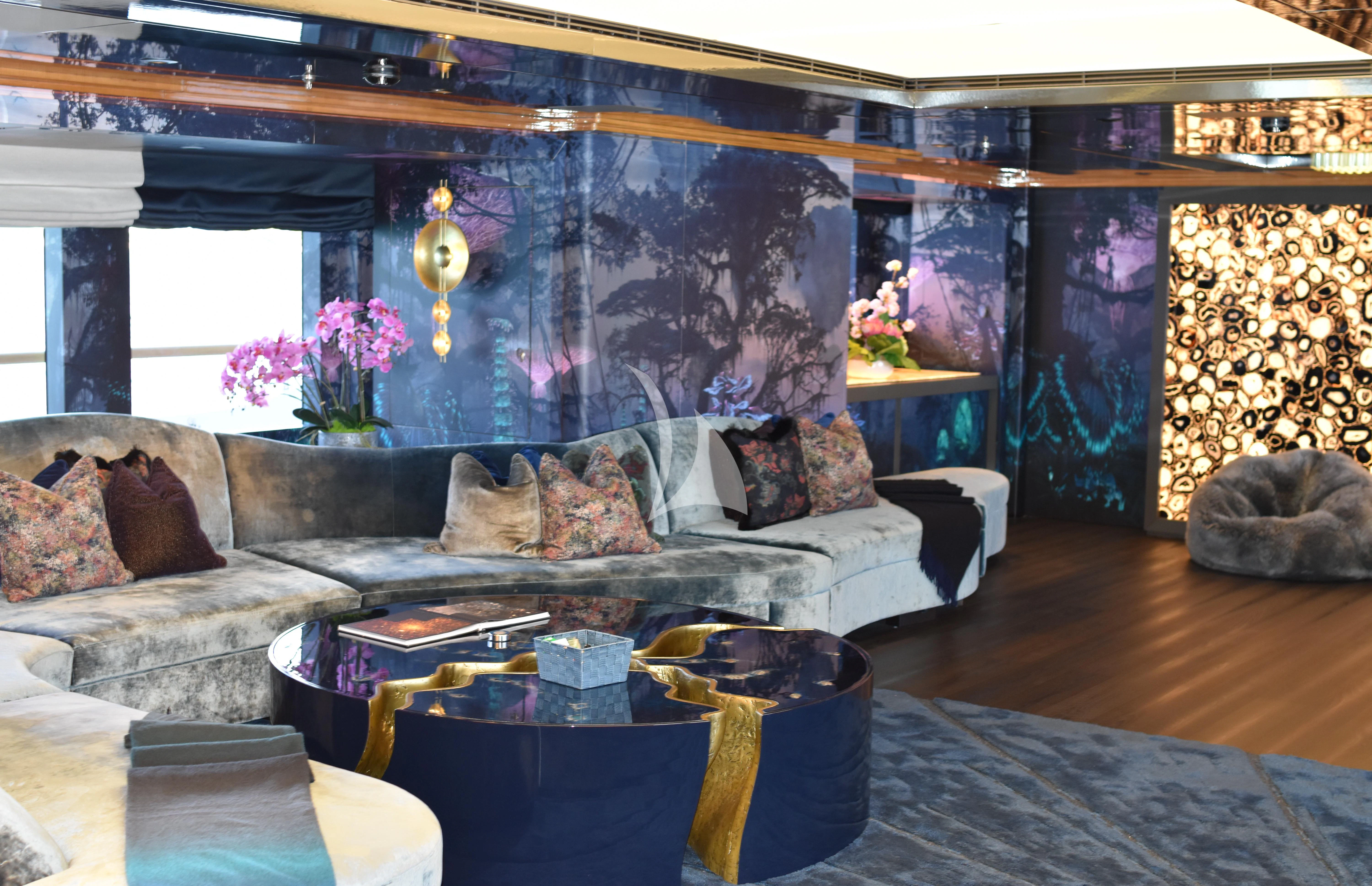 a living room with a couch and a table aboard GALAXY Yacht for Sale