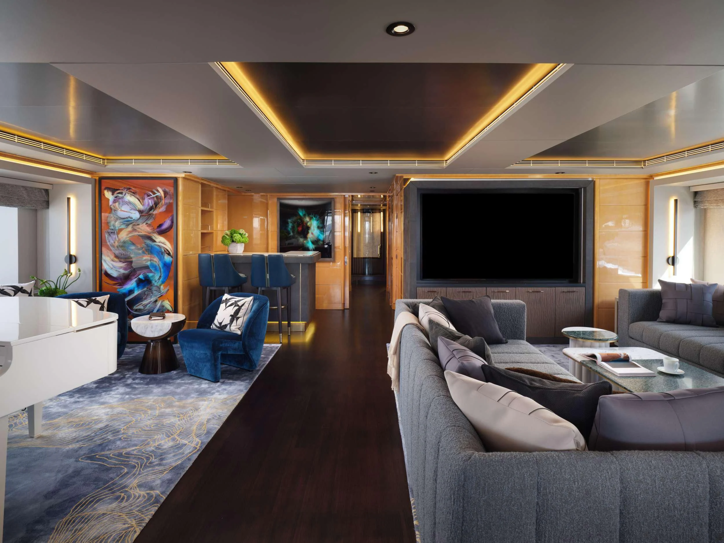 a living room with a large tv aboard GALAXY Yacht for Sale