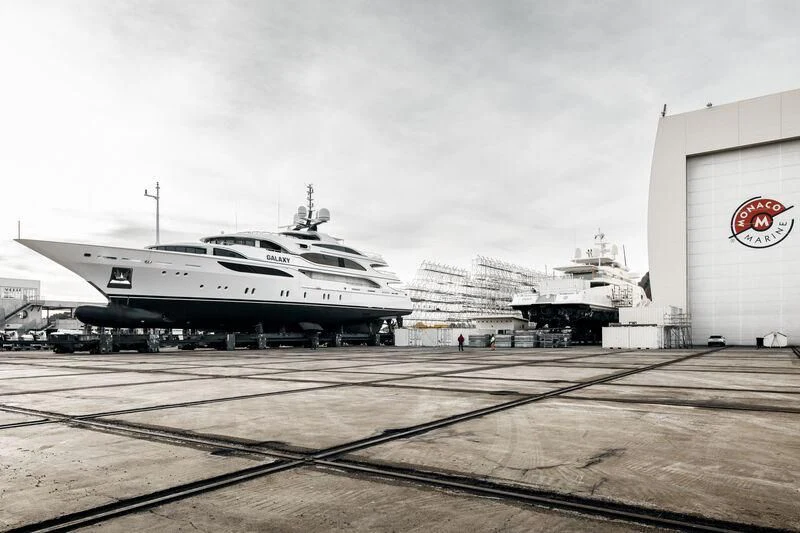 a large white airplane sits on a runway aboard GALAXY Yacht for Sale