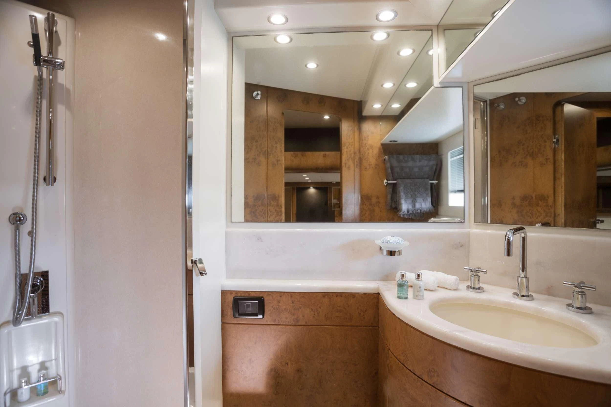 a bathroom with a large mirror aboard ANLIA Yacht for Sale