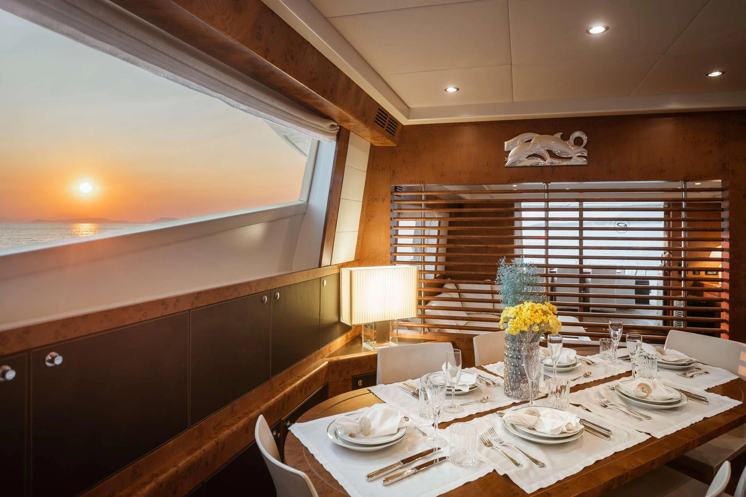 a dining table in a room aboard ANLIA Yacht for Sale