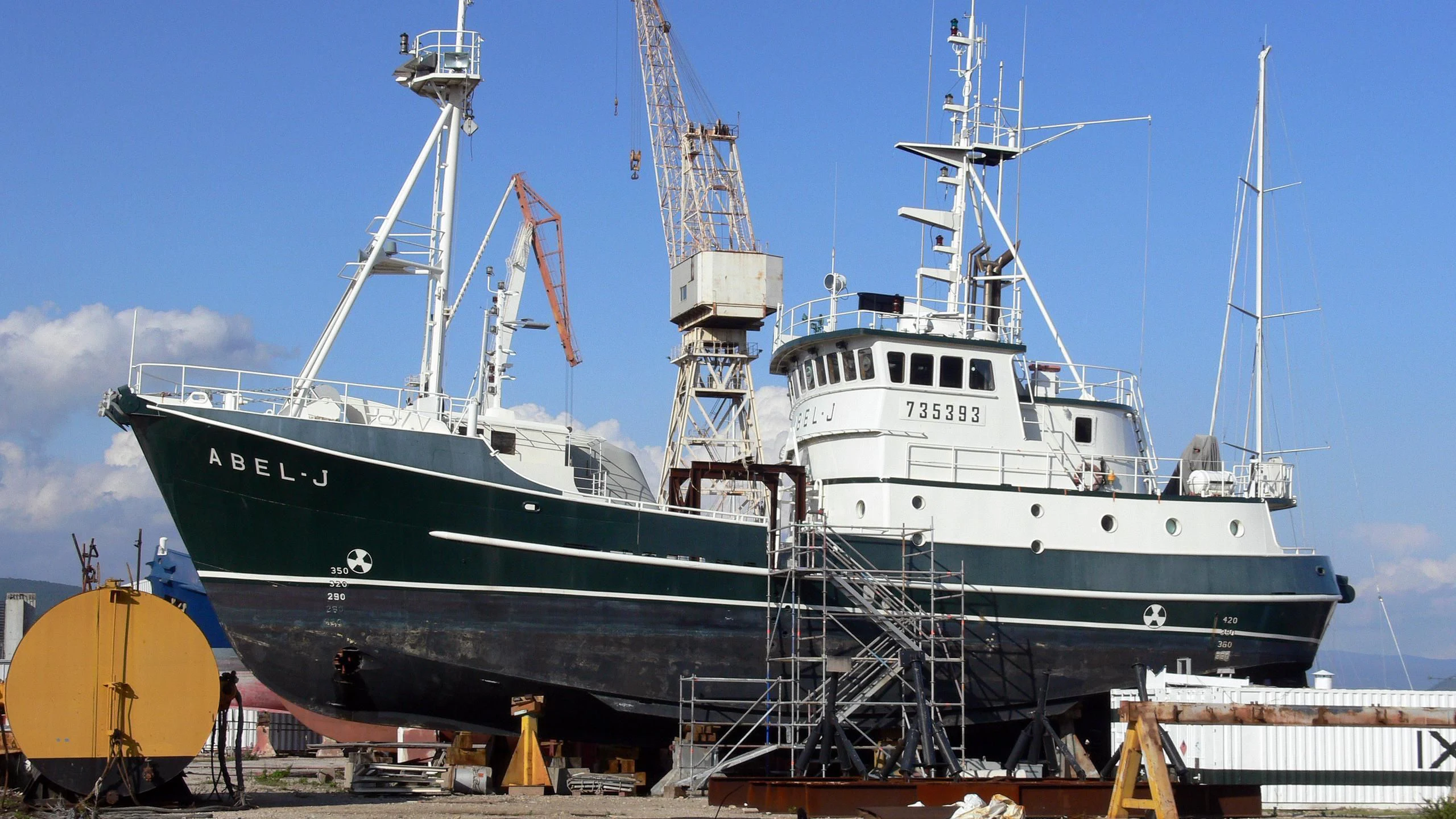 a large ship docked aboard ABEL J Yacht for Sale