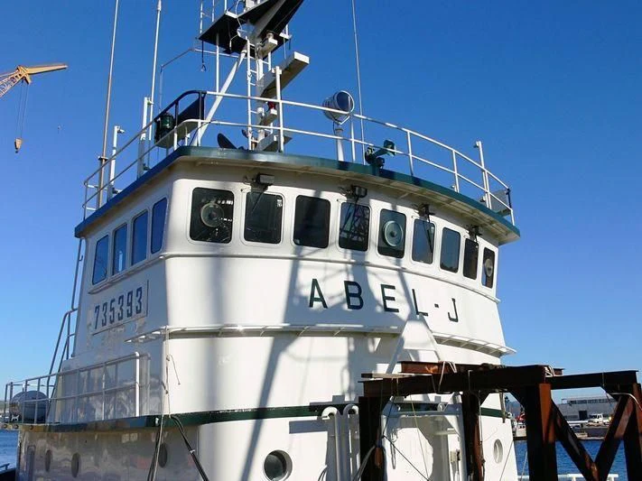 a large white boat aboard ABEL J Yacht for Sale