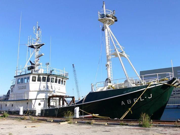 a boat docked at a pier aboard ABEL J Yacht for Sale