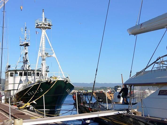 a boat docked at a pier aboard ABEL J Yacht for Sale