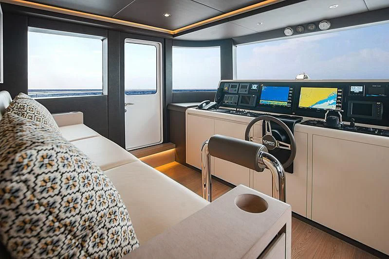 a room with a bed and desk aboard DIGNITY Yacht for Sale