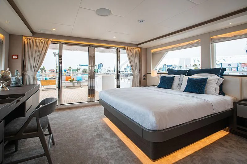 a large bedroom with a large bed aboard DIGNITY Yacht for Sale