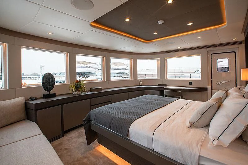 a bedroom with a large bed aboard DIGNITY Yacht for Sale
