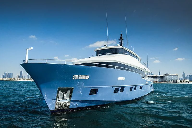 a large white boat in the water aboard DIGNITY Yacht for Sale