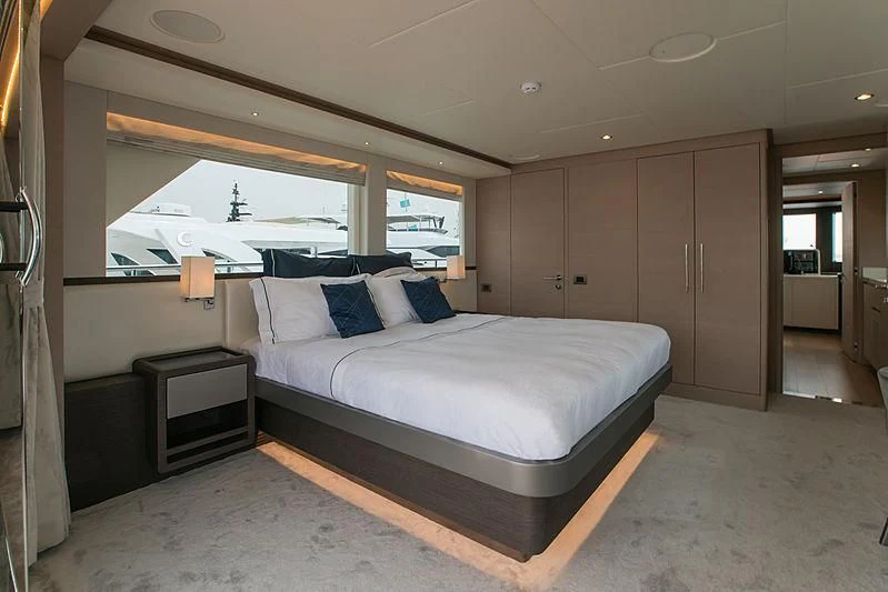 a large bed in a room aboard DIGNITY Yacht for Sale