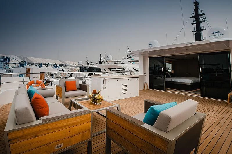 a room with a couch and a table and chairs aboard DIGNITY Yacht for Sale