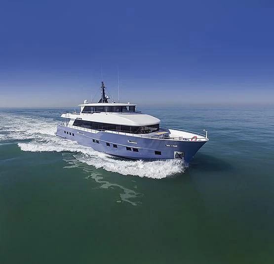 a large white boat in the water aboard DIGNITY Yacht for Sale