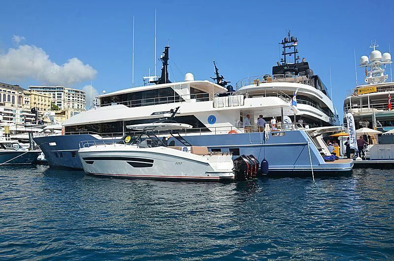 a large white boat with a group of people on it aboard DIGNITY Yacht for Sale