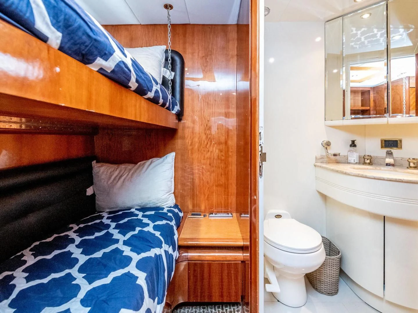 a bed and a sink in a bathroom aboard NUEVA OLA Yacht for Sale