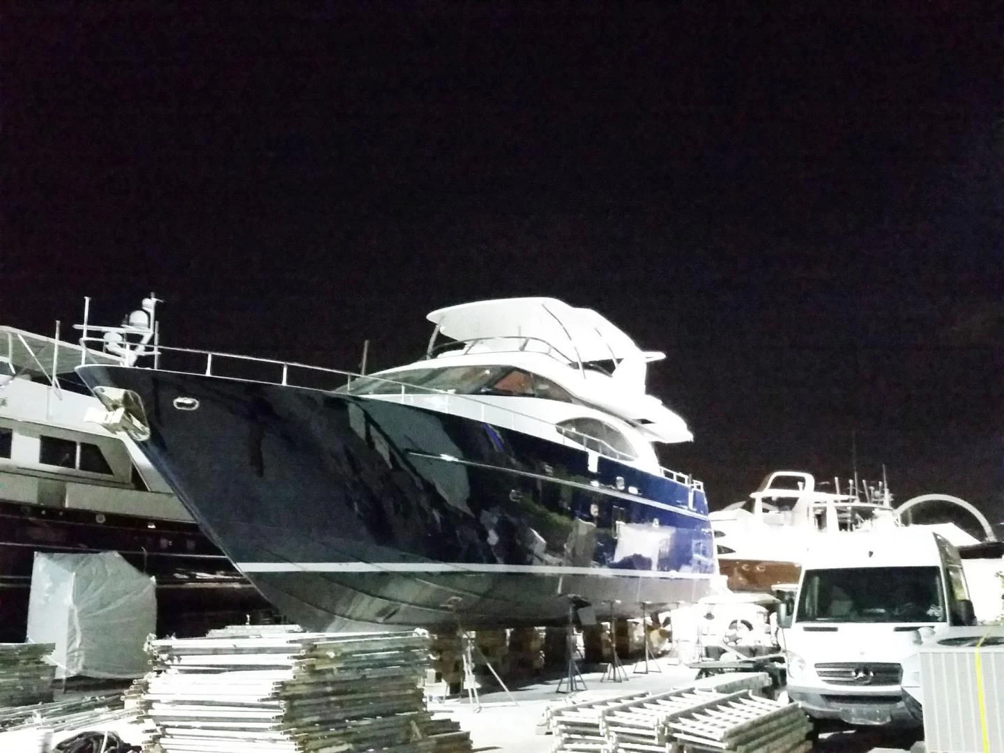 a docked boat at night aboard NUEVA OLA Yacht for Sale