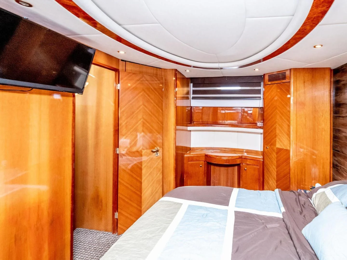 a room with a bed and a closet aboard NUEVA OLA Yacht for Sale