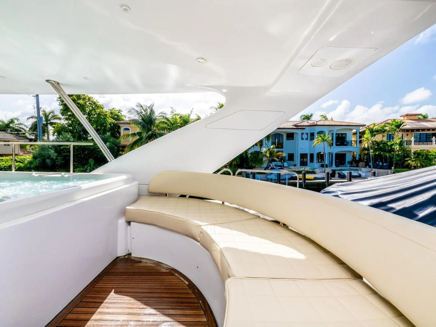 a white building with a balcony aboard NUEVA OLA Yacht for Sale