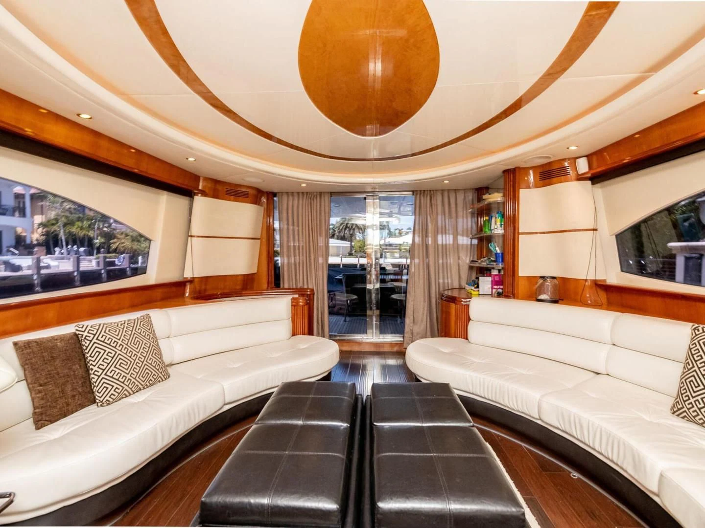 a room with couches and a table aboard NUEVA OLA Yacht for Sale