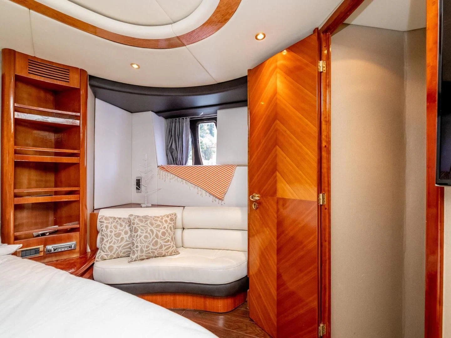 a bedroom with a bed and a closet aboard NUEVA OLA Yacht for Sale