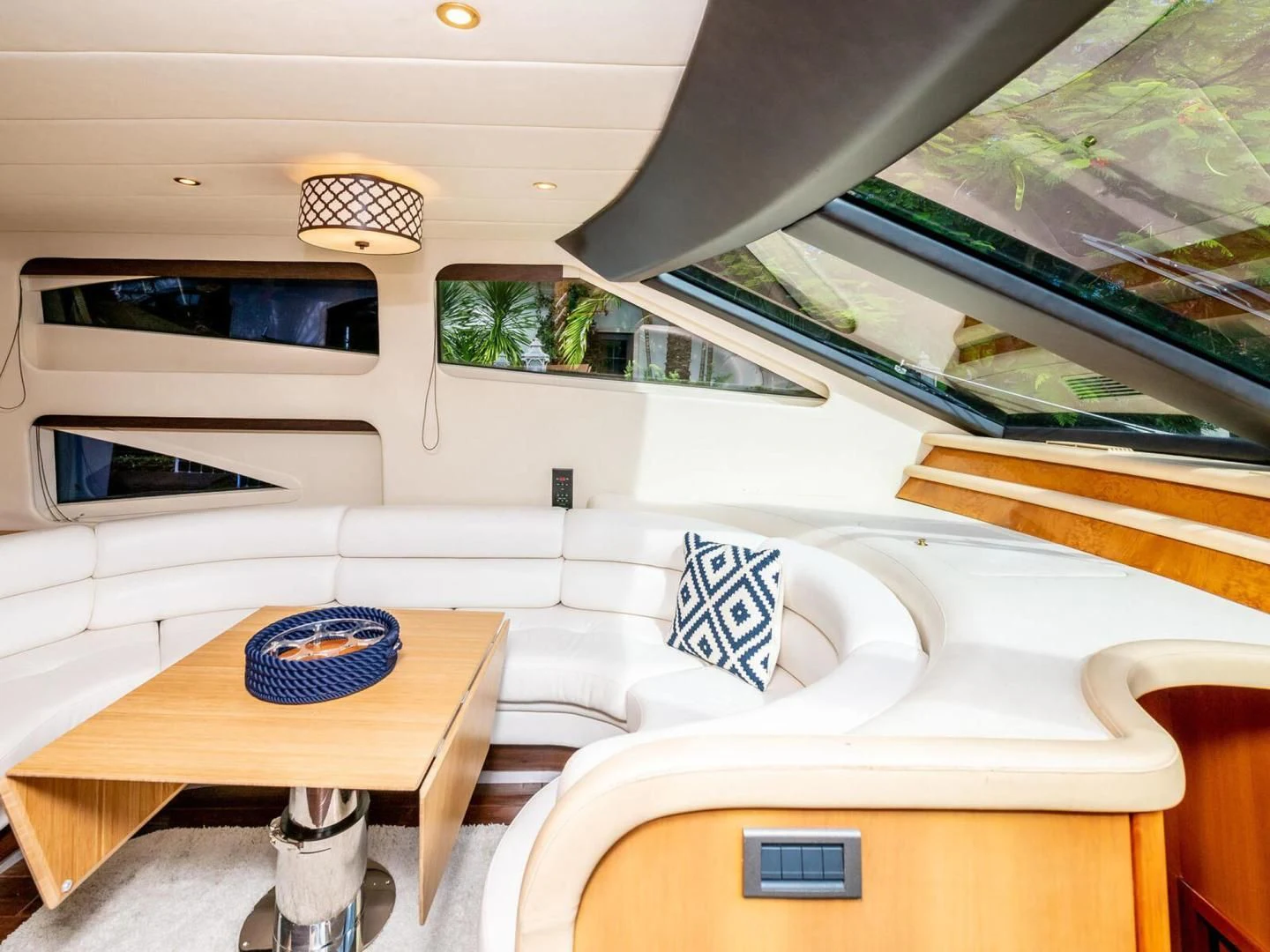 a room with a bed and a table aboard NUEVA OLA Yacht for Sale