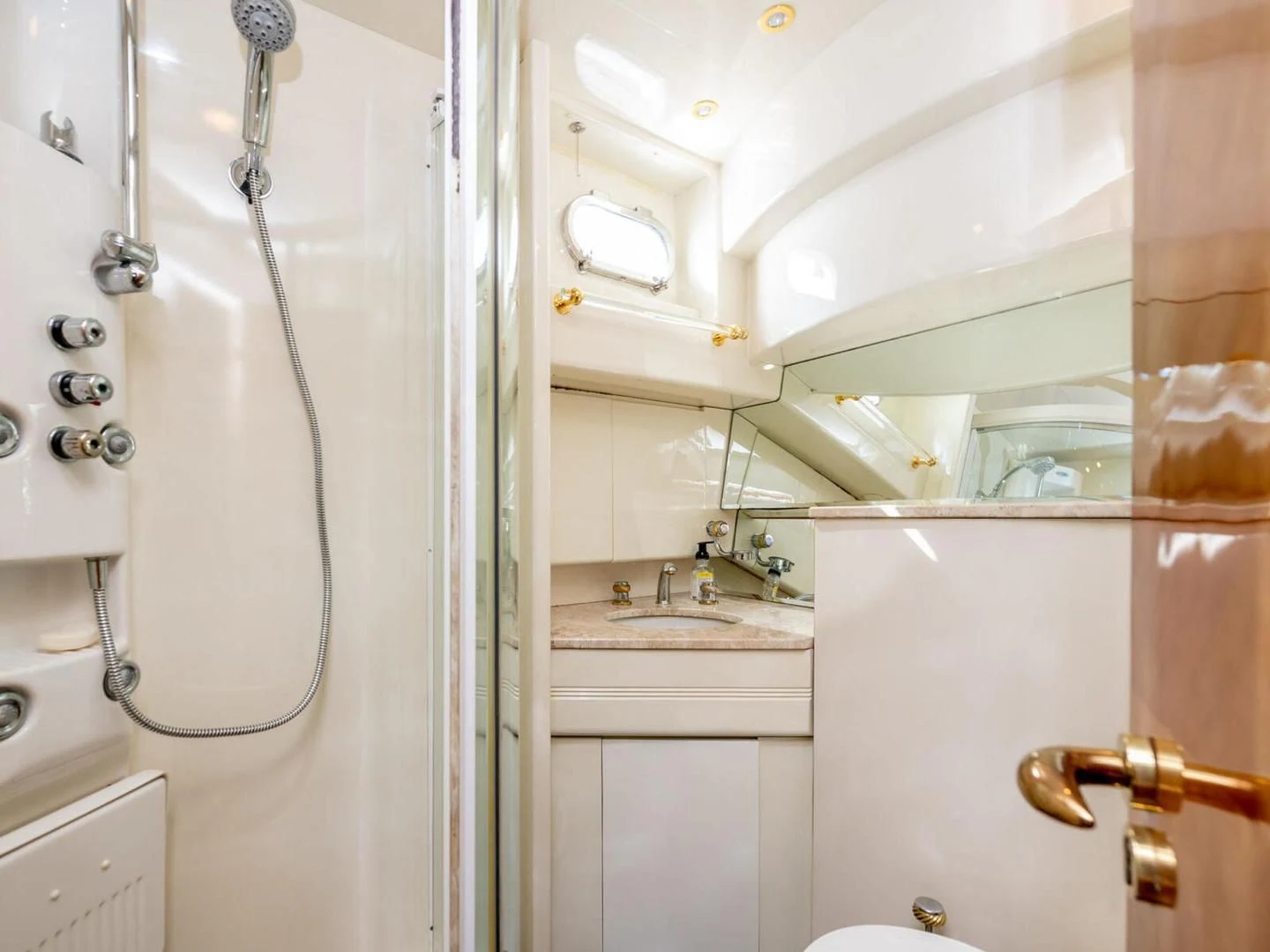 a bathroom with a shower and sink aboard NUEVA OLA Yacht for Sale