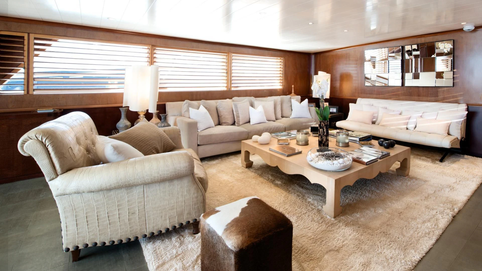 a living room with a couch and a coffee table aboard SIRAHMY Yacht for Sale