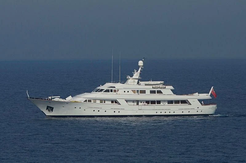 a large white boat in the water aboard SIRAHMY Yacht for Sale