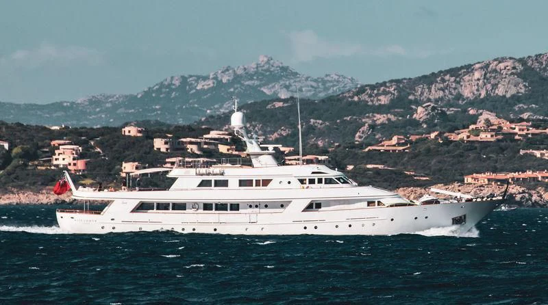 a large white boat in the water aboard SIRAHMY Yacht for Sale