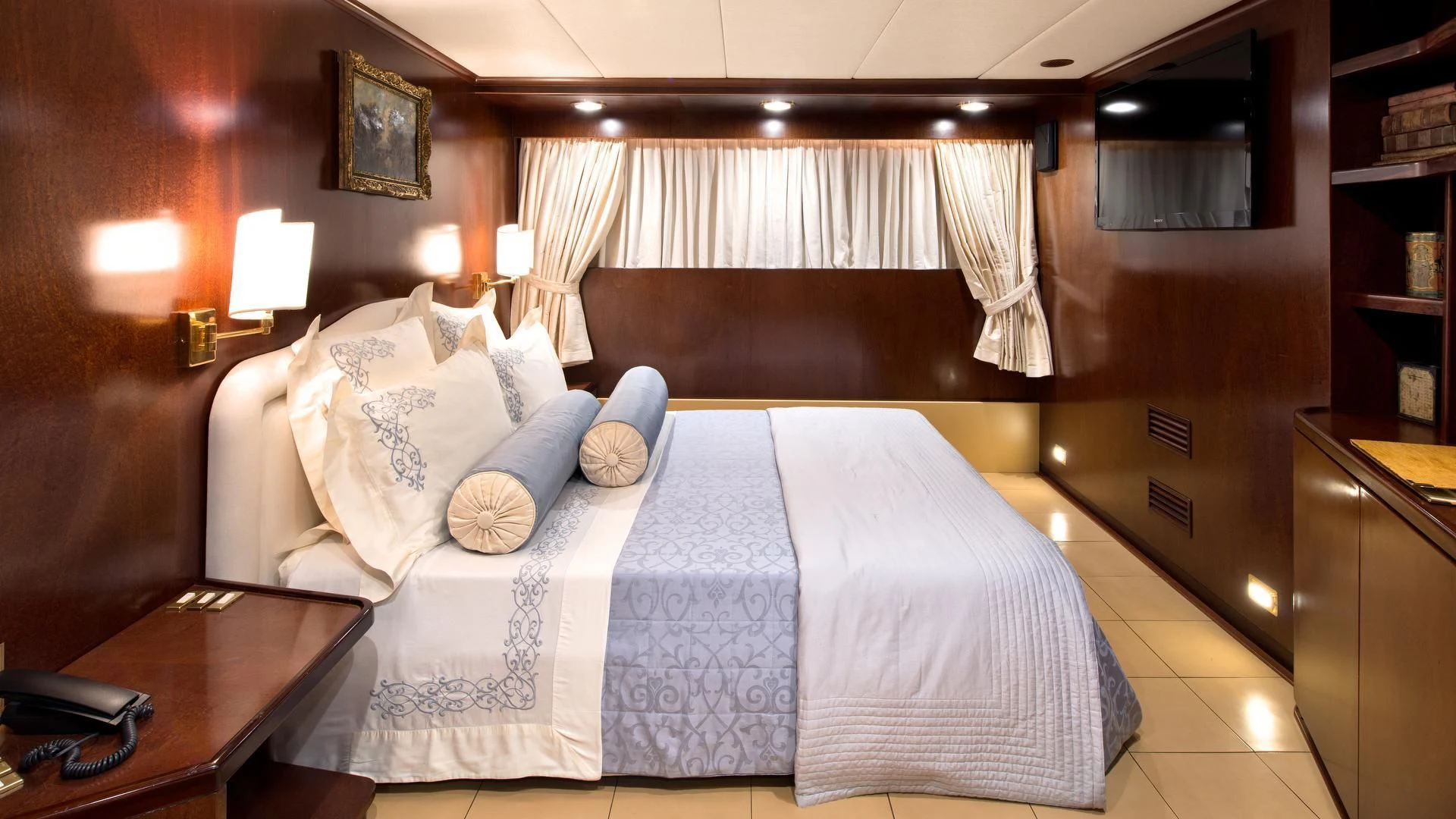 a bed in a room aboard SIRAHMY Yacht for Sale