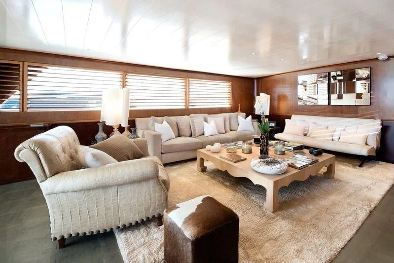 a living room with a couch and a coffee table aboard SIRAHMY Yacht for Sale