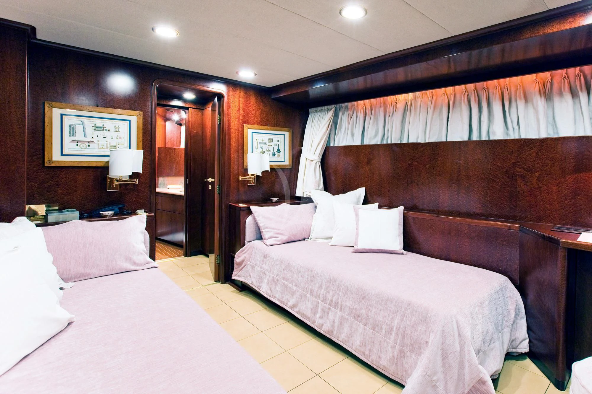 a hotel room with two beds aboard SIRAHMY Yacht for Sale
