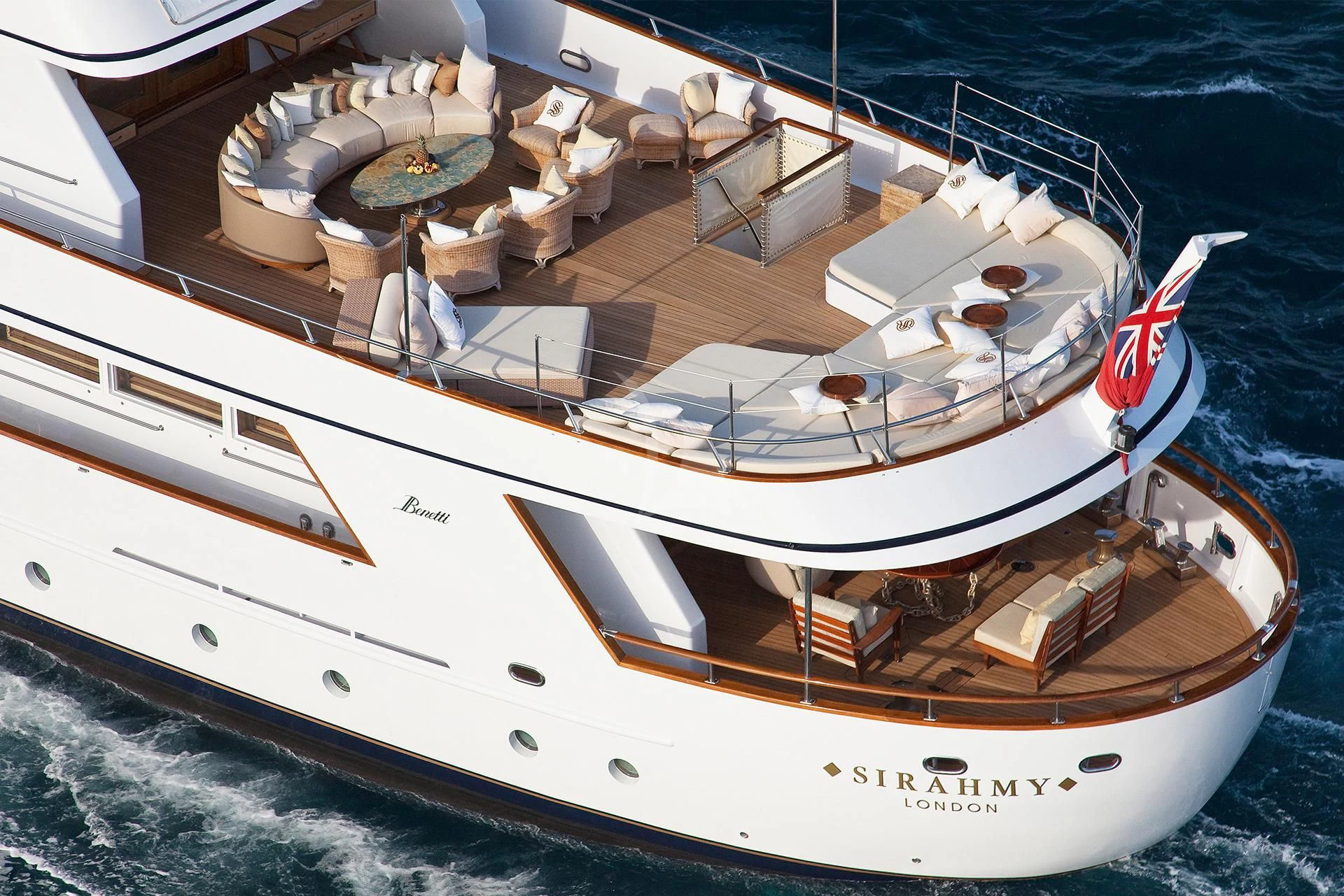a large white boat on the water aboard SIRAHMY Yacht for Sale