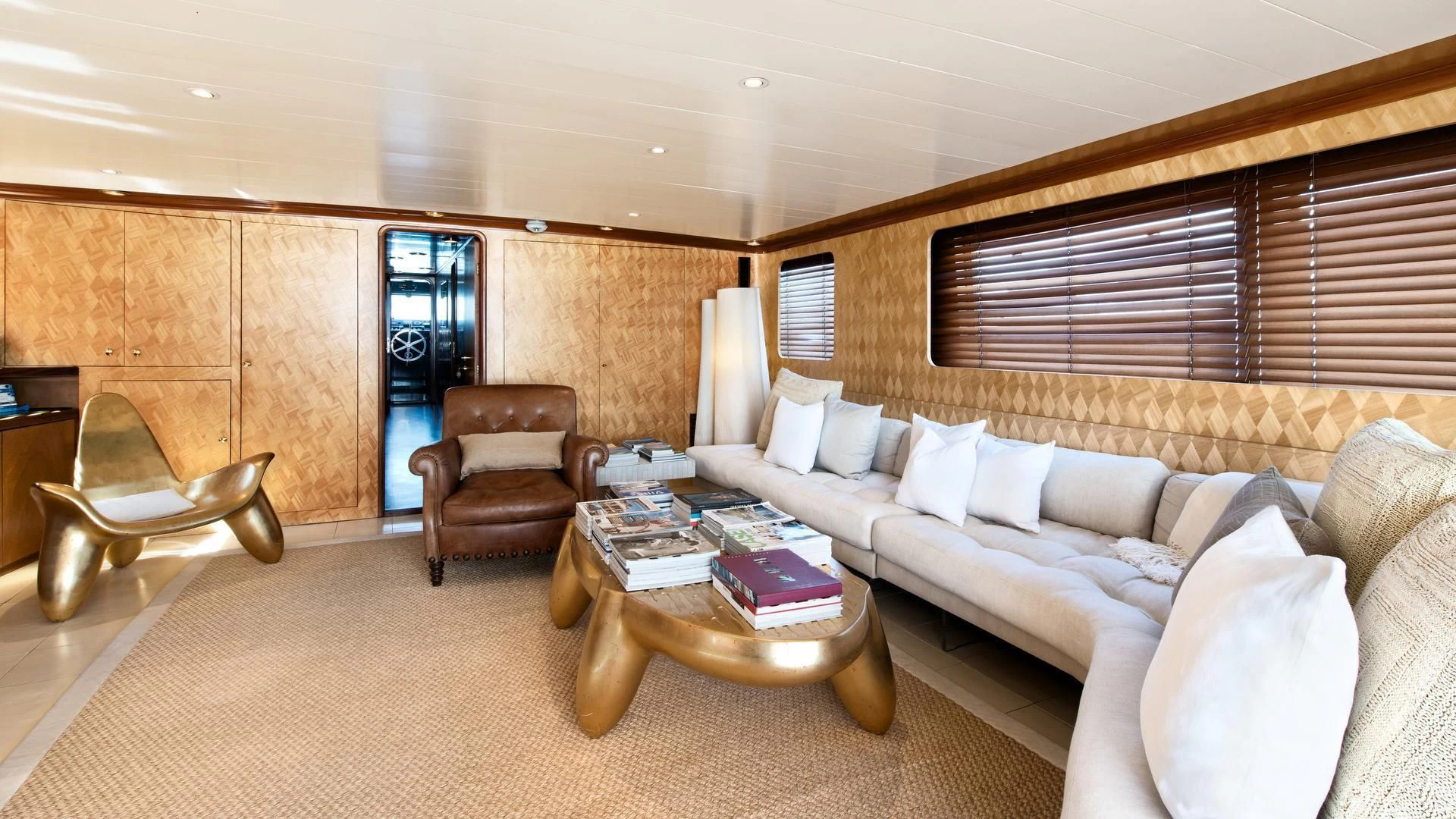 a living room with a couch and a coffee table aboard SIRAHMY Yacht for Sale