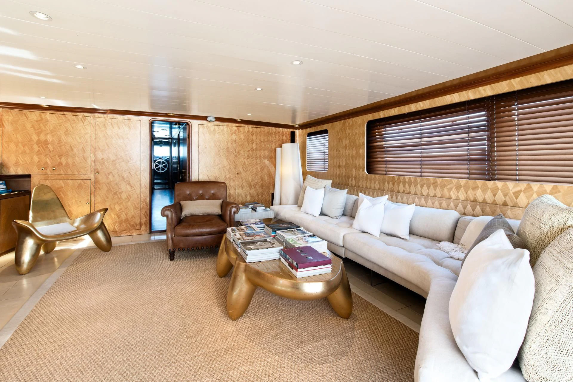 a living room with a couch and a coffee table aboard SIRAHMY Yacht for Sale